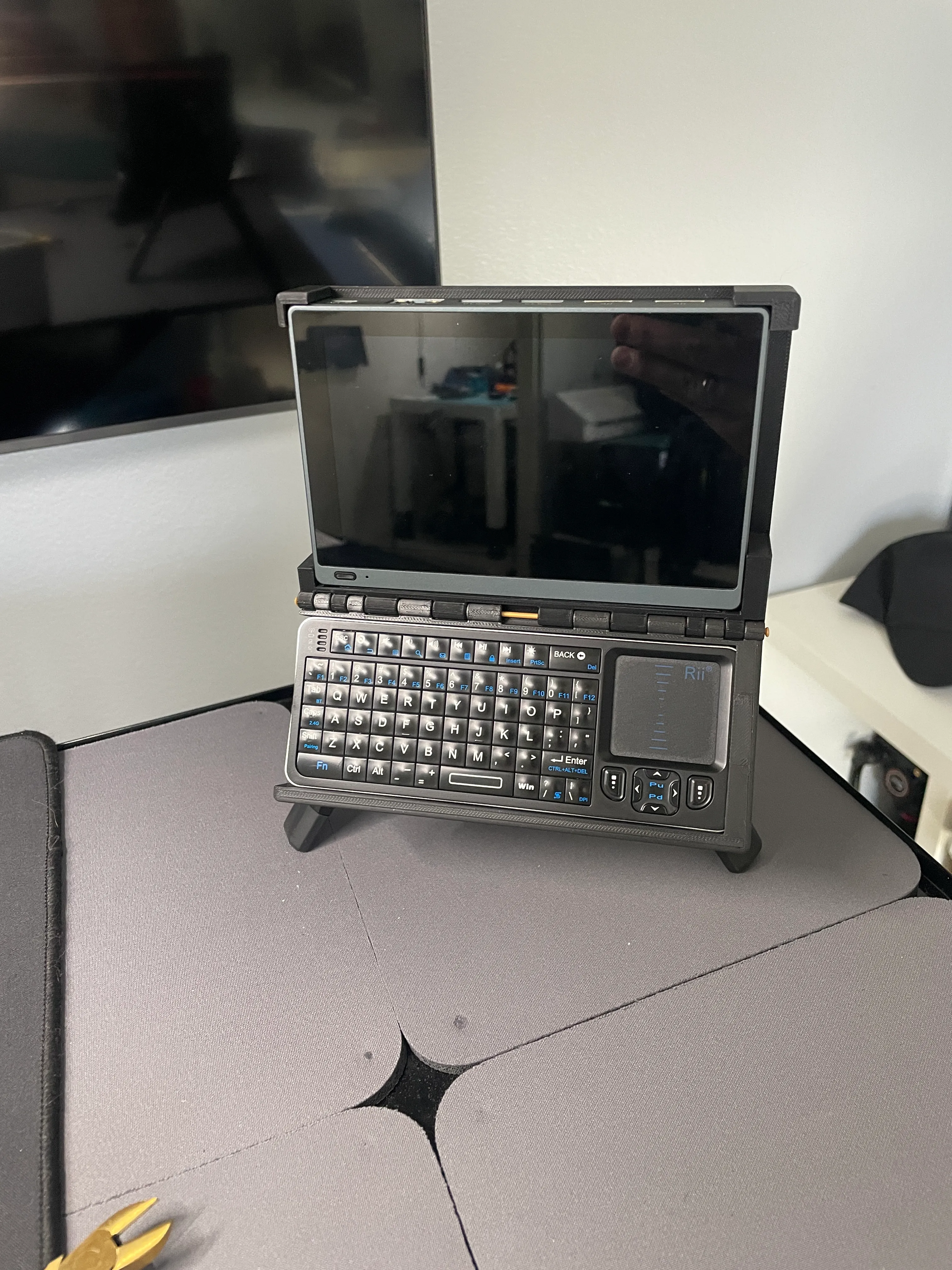 Mini Deck — angled view showing hinge and stand